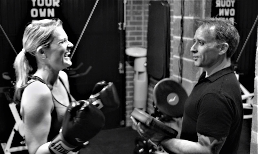 James O'driscoll laughing with personal training client