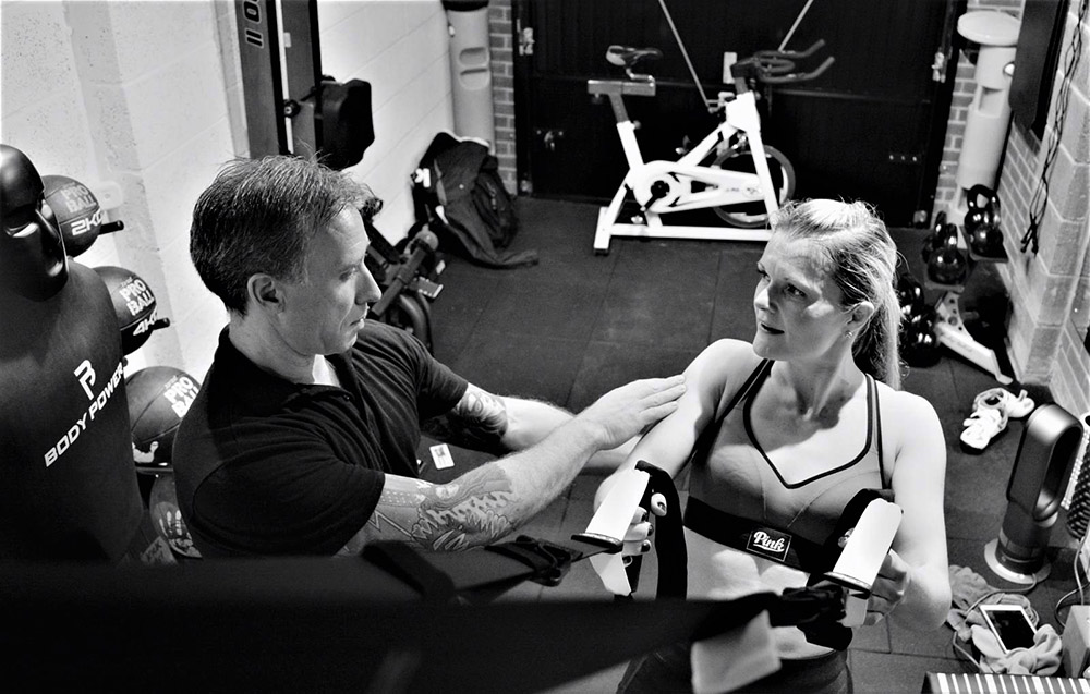 Personal trainer working with client at Simply Fitt Gym