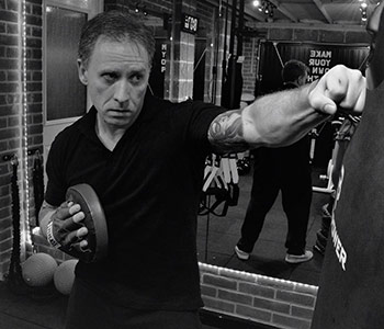 james-o_driscoll-simply-fitt-personal-trainer-using-punchbag